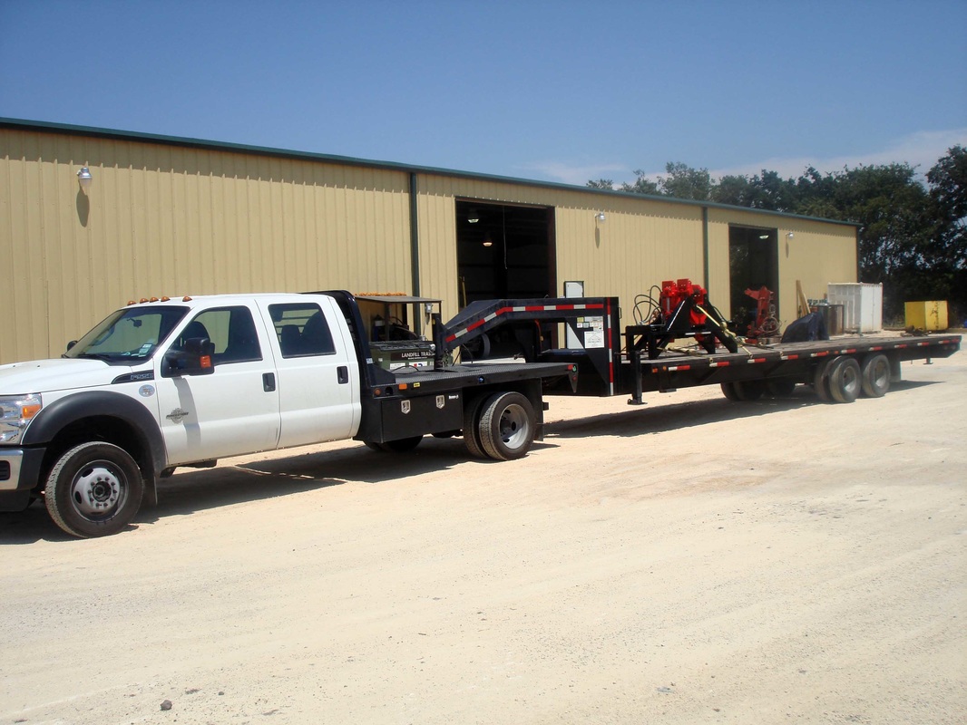 OPI owns and operates a two (2) ton truck as well as a 32 foot gooseneck trailer which can handle loads up to 20,000 lbs.